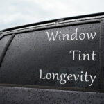 Window tint longevity - tinted windows covered with rain